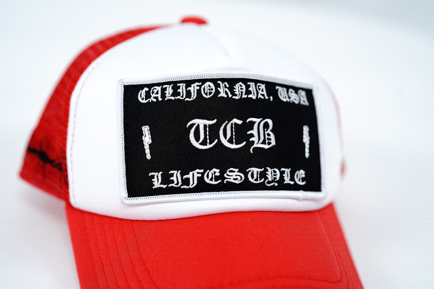RED BARBED FOAM TRUCKER HAT
