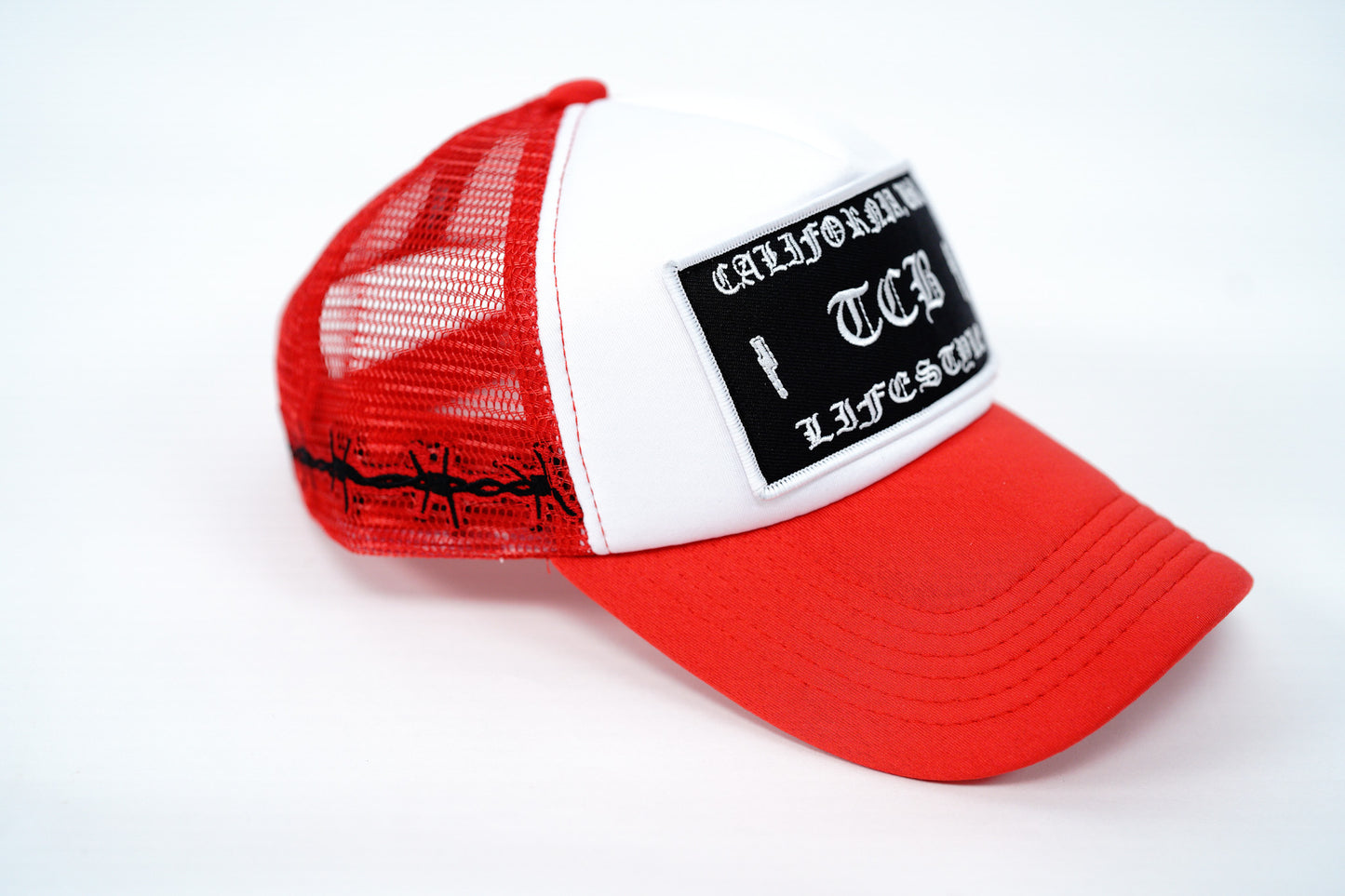 RED BARBED FOAM TRUCKER HAT