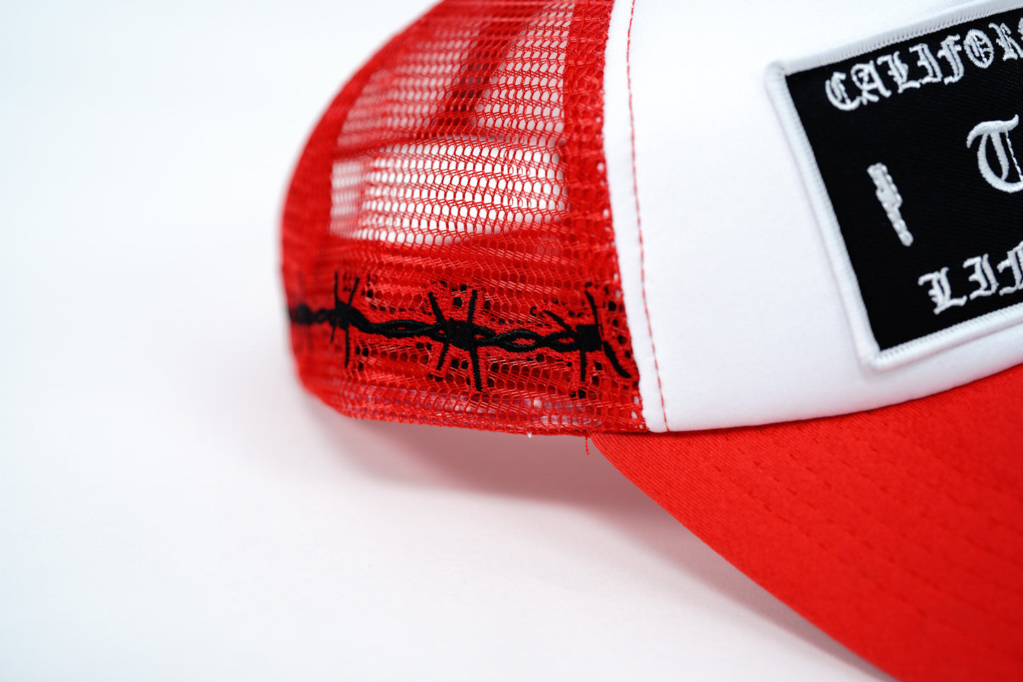 RED BARBED FOAM TRUCKER HAT